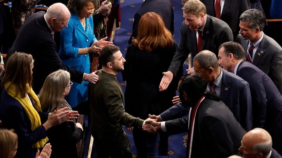 WASHINGTON, DC - DECEMBER 21: President of Ukraine Volodymyr Zelensky greets lawmakers as he arrives to addresses a joint meeting of Congress in the House Chamber of the U.S. Capitol on December 21, 2022 in Washington, DC. In his first known trip outside of Ukraine since Russia invaded, Zelensky met with U.S. President Joe Biden and outlined Ukraine's request for continued military aid. Chip Somodevilla/Getty Images/AFP (Photo by CHIP SOMODEVILLA / GETTY IMAGES NORTH AMERICA / Getty Images via AFP)(Getty Images via AFP)