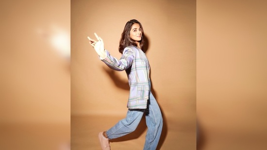 Pooja Hegde's blazer set is from the handwoven clothing line The Loom Art and her sneakers are from Melissa. (Instagram/@hegdepooja)