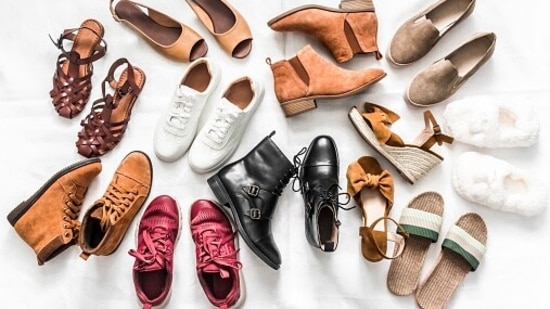 A cluster of mismatched footwear in various colors and styles
