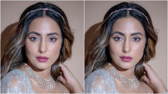Assisted by makeup artist Sachin Salvi, Hina decked up in silver eyeshadow, mascara-laden eyelashes, drawn eyebrows, contoured cheeks and a shade of pink lipstick. (Instagram/@realhinakhan)