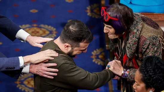 WASHINGTON, DC - DECEMBER 21: President of Ukraine Volodymyr Zelensky greets Rep. Rosa Delauro (D-CT) and other lawmakers as he arrives to address a joint meeting of Congress in the House Chamber of the U.S. Capitol on December 21, 2022 in Washington, DC. In his first known trip outside of Ukraine since Russia invaded, Zelensky met with U.S. President Joe Biden and outlined Ukraine's request for continued military aid. Seated behind Zelensky was U.S. Vice President Kamala Harris (L) and Speaker of the House Nancy Pelosi (D-CA). Anna Moneymaker/Getty Images/AFP (Photo by Anna Moneymaker / GETTY IMAGES NORTH AMERICA / Getty Images via AFP)(Getty Images via AFP)