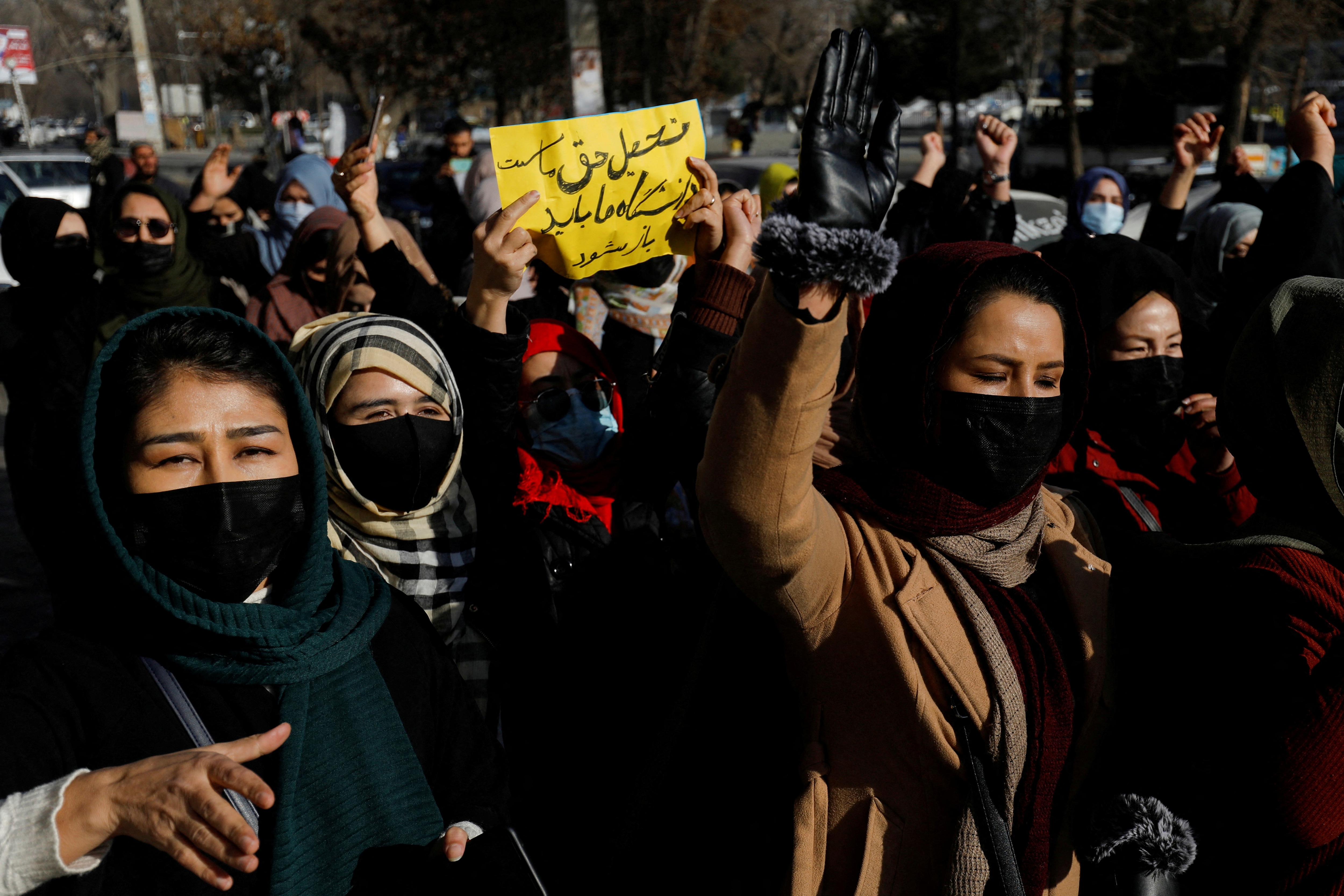 Afghan women chant slogans in protest against the closure of universities to women by the Taliban in Kabul, Afghanistan. (Reuters)