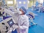 A medic at Thane Municipal Corporation's Covid Center checks equipment as part of preparedness. (PTI) A medic at Thane Municipal Corporation's Covid Center checks equipment as part of preparedness. (PTI)