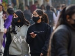 New Delhi: People wear face mask, at Khan Market in New Delhi, Wednesday, Dec. 21, 2022. Union Health Minister Mansukh Mandaviya held a meeting with experts to review the COVID-19 situation considering the fresh rise of cases in other countries, especially China. (PTI Photo/Kamal Singh) New Delhi: People wear face mask, at Khan Market in New Delhi, Wednesday, Dec. 21, 2022. Union Health Minister Mansukh Mandaviya held a meeting with experts to review the COVID-19 situation considering the fresh rise of cases in other countries, especially China. (PTI Photo/Kamal Singh)