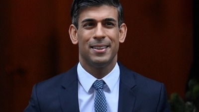 Rishi Sunak: British Prime Minister Rishi Sunak walks outside Downing Street in London, Britain. (Reuters)