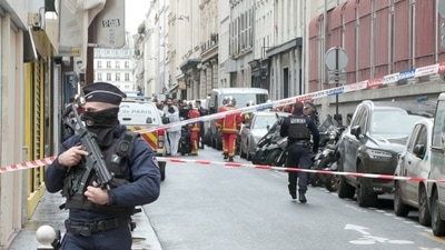 Paris Shooting: Members of emergency services work at the site where gunshots were fired. (Reuters)