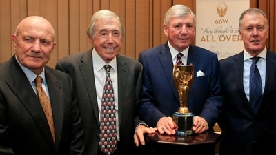 Members of the England 1966 World Cup winning team, from left, George Cohen, Gordon Banks, Martin Peters and Geoff Hurst pose for the media with the official English Football Association replica of the Jules Rimet trophy, at the Royal Garden Hotel in London Tuesday, Jan. 5, 2016. George Cohen, the right-back for England World Cup-winning team of 1966, has died aged 83, his former club Fulham have announced on Friday, Dec. 23, 2022. (AP)