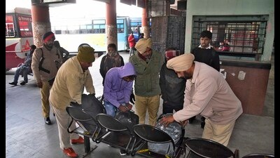 Police checking luggage of passengers at the Ludhiana bus stand on Friday. (Harvinder Singh/HT)