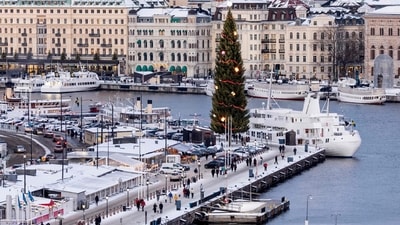 7. Stockholm in Sweden - Strollers can walk along the Skeppsbron quayside with its traditional Christmas tree in a snow covered wintery landscape of Stockholm in Sweden while the Christmas market around the Stortorget Square is host to red stalls, lip-smacking Swedish delicacies like eel, smoked sausages, elk meat, dry cured reindeer, Nordic glogg, mulled wine, traditional ginger biscuit or pepparkakor, special ornamental art pieces and beautiful handicrafts. (Photo by Christine OLSSON / TT News Agency / AFP) 7. Stockholm in Sweden - Strollers can walk along the Skeppsbron quayside with its traditional Christmas tree in a snow covered wintery landscape of Stockholm in Sweden while the Christmas market around the Stortorget Square is host to red stalls, lip-smacking Swedish delicacies like eel, smoked sausages, elk meat, dry cured reindeer, Nordic glogg, mulled wine, traditional ginger biscuit or pepparkakor, special ornamental art pieces and beautiful handicrafts. (Photo by Christine OLSSON / TT News Agency / AFP)