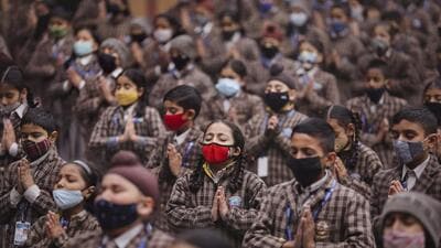 Students in a Jammu school wear masks as a precautionary measure against Covid on Friday. (PTI) Students in a Jammu school wear masks as a precautionary measure against Covid on Friday. (PTI)