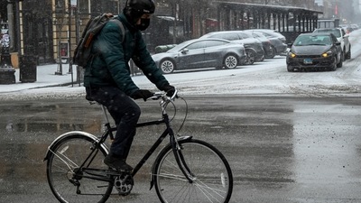 US Bomb Cyclone: A bicyclist makes his way along Halsted Street during cold weather. (Reuters)