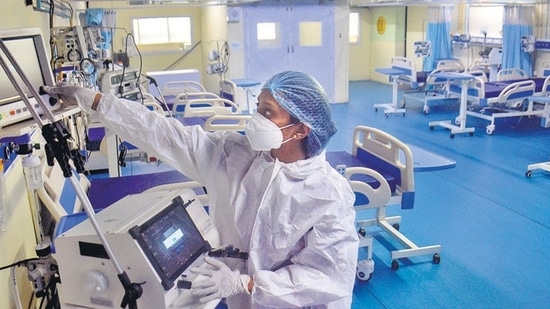 A medic at Thane Municipal Corporation's Covid Center checks equipment as part of preparedness. (PTI)