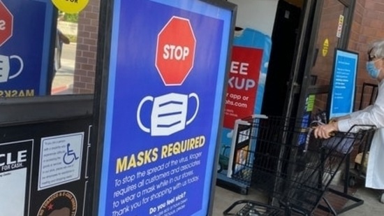 Covid In US: People shop at a grocery store enforcing the wearing of masks in Los Angeles.(AFP File) Covid In US: People shop at a grocery store enforcing the wearing of masks in Los Angeles.(AFP File)