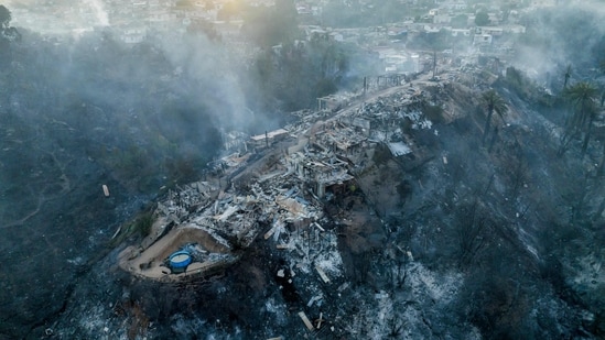 Aerial view of houses destroyed by a forest fire that affected the hills of Vina del Mar, Chile, taken Friday. The fire which broke out Thursday has promoted the government to declare a state of emergency.(AFP)