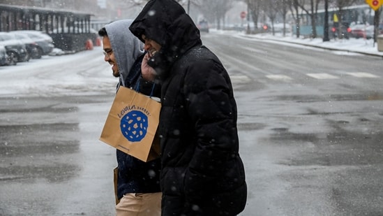 Bomb Cyclone In US: Pedestrians make their way along Halsted Street during a cold weather front.(Reuters)