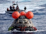 NASA's Orion capsule is drawn to the well deck of the U.S.S. Portland after it splashed down following a successful uncrewed Artemis I Moon Mission.(Mario Tama / REUTERS) NASA's Orion capsule is drawn to the well deck of the U.S.S. Portland after it splashed down following a successful uncrewed Artemis I Moon Mission.(Mario Tama / REUTERS)