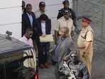 FTX founder Sam Bankman-Fried, center, is escorted out of Magistrate Court into a Corrections van, following a hearing in Nassau, Bahamas. FTX founder Sam Bankman-Fried, center, is escorted out of Magistrate Court into a Corrections van, following a hearing in Nassau, Bahamas.
