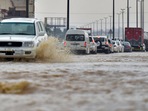 Saudi Arabia Flash Floods: Cars drive through a flooded street following heavy rains. Saudi Arabia Flash Floods: Cars drive through a flooded street following heavy rains.