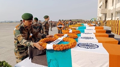 Indian Army personnel laying wreaths at the mortal remains of the soldiers, who lost their lives in a road accident in the Zema area of North Sikkim, on Saturday. (ANI ) Indian Army personnel laying wreaths at the mortal remains of the soldiers, who lost their lives in a road accident in the Zema area of North Sikkim, on Saturday. (ANI )