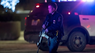 A police officer carrying a rifle exits the Mall of America following a shooting in December 2021. (AP file) A police officer carrying a rifle exits the Mall of America following a shooting in December 2021. (AP file)