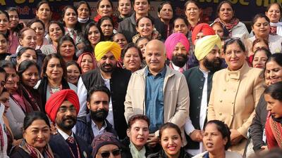 Punjab chief minister Bhagwant Mann with Delhi deputy chief minister Manish Sisodia during the mega PTM in Patiala on Saturday. (ANI Photo)
