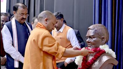 Uttar Pradesh chief minister Yogi Adityanath offering floral tribute to a bust of former Prime Minister the late Atal Bihari Vajpayee on the eve of his birth anniversary, in Lucknow on Saturday. (SOURCED IMAGE) Uttar Pradesh chief minister Yogi Adityanath offering floral tribute to a bust of former Prime Minister the late Atal Bihari Vajpayee on the eve of his birth anniversary, in Lucknow on Saturday. (SOURCED IMAGE)