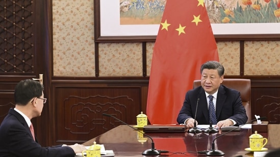 Hong Kong: Chinese President Xi Jinping, right, talks to Hong Kong Chief Executive John Lee during a meeting. (AP)