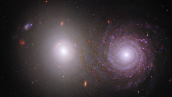 By combining data from NASA’s James Webb Space Telescope and NASA’s Hubble Space Telescope, researchers were able to trace light that was emitted by the large white elliptical galaxy at left through the spiral galaxy at right and identify the effects of interstellar dust in the spiral galaxy.(NASA, ESA, CSA, Rogier Windhorst (ASU), William Keel (University of Alabama), Stuart Wyithe (University of Melbourne), JWST PEARLS Team)