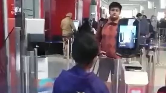 The boy using facial recognition technology. (Screengrab/Delhi Airport video on Twitter