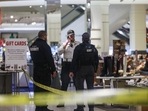 Security officers speak inside a store at the Mall of America in Bloomington, Minnesota. (Kerem Yücel/Minnesota Public Radio via AP) Security officers speak inside a store at the Mall of America in Bloomington, Minnesota. (Kerem Yücel/Minnesota Public Radio via AP)