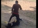 The man initially gets irritated and then proceeds to kick and slap her repeatedly in the face. The man initially gets irritated and then proceeds to kick and slap her repeatedly in the face.