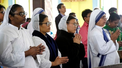 Nuns offer prayers at a church in Kolkata. (ANI) Nuns offer prayers at a church in Kolkata. (ANI)