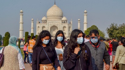 Tourists wearing face masks visit the Taj Mahal in Agra on Saturday, (PTI) Tourists wearing face masks visit the Taj Mahal in Agra on Saturday, (PTI)