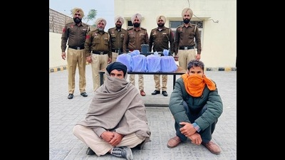 The arrested men, identified as Dalbir and Jagdish, residents of Gharinda village in Amritsar, had been engaged in drug trafficking for the last three years. (HT photo) The arrested men, identified as Dalbir and Jagdish, residents of Gharinda village in Amritsar, had been engaged in drug trafficking for the last three years. (HT photo)