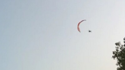 Screenshot of the video, moments before the man fell on the ground after losing control while in the air.