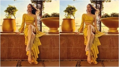 Manushi decked up in a yellow gown with one-shoulder and midriff-baring details. It featured pleated and frill details below the waist. (Instagram/@manushi_chhillar) Manushi decked up in a yellow gown with one-shoulder and midriff-baring details. It featured pleated and frill details below the waist. (Instagram/@manushi_chhillar)