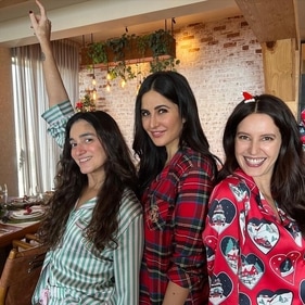 Katrina and Isabelle pose together on Christmas.
