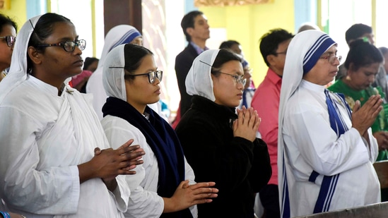Nuns offer prayers at a church in Kolkata.(ANI)
