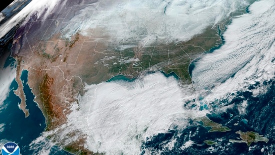 This satellite image made available by NOAA shows weather systems across North America on Saturday. A battering winter storm left millions more to worry about the prospect of further outages and crippled police, fire departments and an airport in snow-blown New York state. (AP)