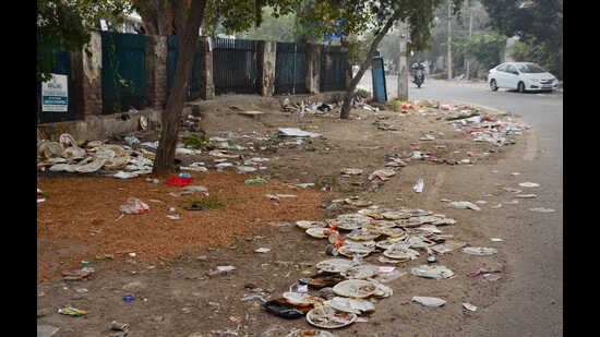 Garbage strewn on the road outside Sutlej Club. (Harvinder Singh/HT)