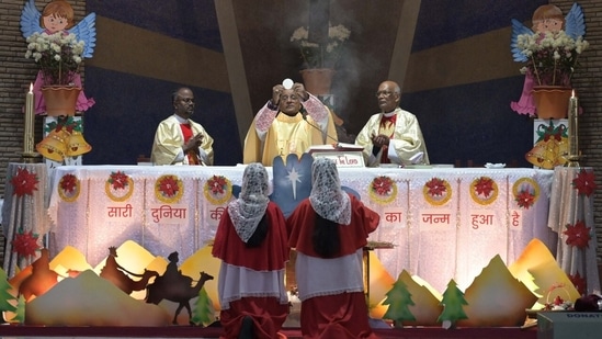 Special prayers being offered at a church in Chandigarh on the occasion of Christmas.&nbsp;(Keshav Singh/HT Photo)