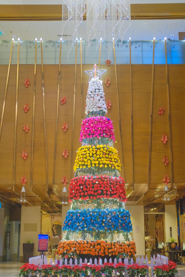 A 30-foot Christmas tree at Crowne Plaza New Delhi Okhla has 5,200 colourful carnations, handcrafted from recycled paper and tissues in rainbow hues. A 30-foot Christmas tree at Crowne Plaza New Delhi Okhla has 5,200 colourful carnations, handcrafted from recycled paper and tissues in rainbow hues.
