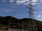 Greece Energy Crisis: Wind turbines are seen on a hill in front of a power station in Greece,(Reuters)