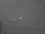 Vehicles commute amid dense fog on a cold winter morning, in Amritsar on Sunday. Vehicles commute amid dense fog on a cold winter morning, in Amritsar on Sunday.