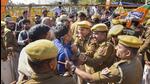 Ajmer: Police personnel detain a BJP supporter during a protest against the state government over the alleged 2nd Grade Teacher recruitment paper leak in Ajmer on Monday (PTI) Ajmer: Police personnel detain a BJP supporter during a protest against the state government over the alleged 2nd Grade Teacher recruitment paper leak in Ajmer on Monday (PTI)