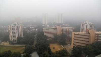 A view of high-rise buildings engulfed in dense smog in New Delhi, on December 26. The IMD declares a coldwave in a region when the minimum temperature is 4.5 degrees or more below the normal mark, or when it drops to 4 degrees Celsius or lower. Both the Ridge (3 degrees) and Ayanagar (3.5 degrees) stations met this criterion on December 25, but Safdarjung did not. (PTI)