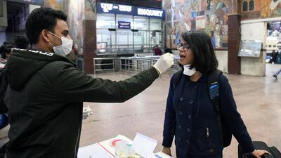 A healthcare worker collects a swab sample from a passenger at railway station in Patna on Monday. (ANI) A healthcare worker collects a swab sample from a passenger at railway station in Patna on Monday. (ANI)