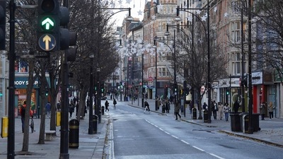 Covid In UK: People walk along a shopping street, ahead of stores opening for the traditional Boxing Day sales in London. (Reuters)