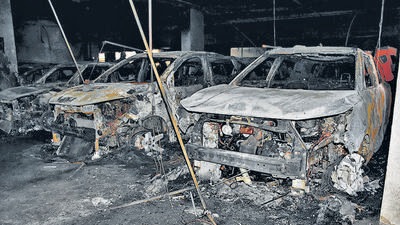 Charred remains of cars in a multi-storey parking lot at Subhash Nagar, in New Delhi, Monday. (HT Photo) Charred remains of cars in a multi-storey parking lot at Subhash Nagar, in New Delhi, Monday. (HT Photo)