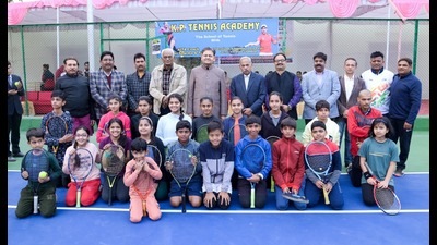 Judge of Allahabad High Court, Justice Siddharth (centre) poses with participants at the opening of the All India National Ranking Under-14 Tennis Series in Prayagraj on Monday. (HT)